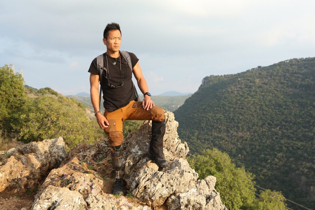Albert Lin poses for a portrait as explores the remains of a forgotten Canaanite outpost in the mountains of Ein Tamir.